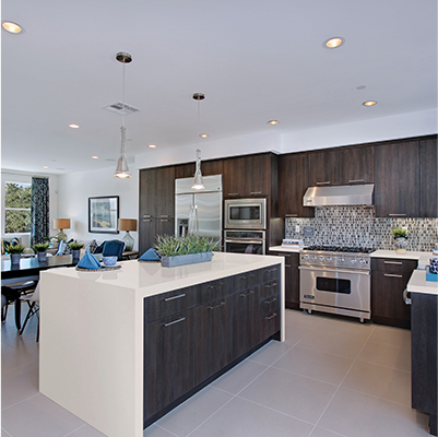 kitchen with quartz countertops featuring island with waterfall countertops